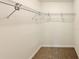 Empty walk-in closet with wire shelving and neutral carpet at 1370 Sw Obee Ridge Rd, Dunnellon, FL 34432