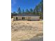 New construction home featuring neutral colors, an attached garage, and front yard surrounded by tall trees at 1370 Sw Obee Ridge Rd, Dunnellon, FL 34432
