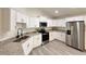 Beautiful kitchen features stainless appliances, granite countertops and white cabinetry with an open concept layout at 1370 Sw Obee Ridge Rd, Dunnellon, FL 34432