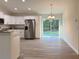 Bright kitchen features new stainless appliances, granite countertops and overlooks a backyard and an adjacent dining area at 1370 Sw Obee Ridge Rd, Dunnellon, FL 34432