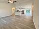 Spacious living room boasts stylish floors with an open-concept layout to the modern kitchen with stainless appliances at 1370 Sw Obee Ridge Rd, Dunnellon, FL 34432