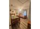 Cozy bedroom with twin beds, ceiling fan, and ample natural light at 13949 Se 53Rd Ave, Summerfield, FL 34491