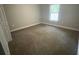 Bedroom with neutral walls, carpet, and bright window at 1645 Sw 168Th Loop, Ocala, FL 34473