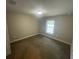This carpeted bedroom has natural light and neutral walls at 1645 Sw 168Th Loop, Ocala, FL 34473