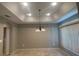 Spacious dining room has a tray ceiling, chandelier and tile floors at 1645 Sw 168Th Loop, Ocala, FL 34473