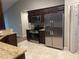 Shows the kitchen with stainless steel refrigerator, range and microwave and tile flooring at 1645 Sw 168Th Loop, Ocala, FL 34473
