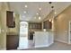Bright kitchen with dark wood cabinets, granite countertops and bar seating open to the living area at 1645 Sw 168Th Loop, Ocala, FL 34473