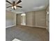 Spacious living room with neutral walls, carpet floors and ceiling fan at 1645 Sw 168Th Loop, Ocala, FL 34473