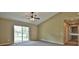 Bright living room featuring a ceiling fan and sliding glass doors to the backyard at 1645 Sw 168Th Loop, Ocala, FL 34473