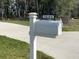 Close-up of a white mailbox with the house number '1645' displayed on a black plate at 1645 Sw 168Th Loop, Ocala, FL 34473