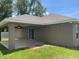 Back patio with ceiling fan overlooking the landscaped yard at 1645 Sw 168Th Loop, Ocala, FL 34473