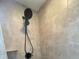 Tiled shower with black shower head and hardware at 1645 Sw 168Th Loop, Ocala, FL 34473