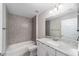 Bathroom features a tub, shower, white vanity, granite countertop and brushed nickel faucet at 17672 Sw 112Th Ln, Dunnellon, FL 34432