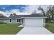 Charming single-story home with a well-manicured lawn and a two-car garage, perfect for Gathering living at 17672 Sw 112Th Ln, Dunnellon, FL 34432