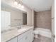 The bathroom features a marble top vanity, white cabinets, and a shower-tub combination at 17718 Sw 112Th Ln, Dunnellon, FL 34432