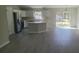 Modern kitchen with stainless steel appliances, an island, and a view of the backyard at 17718 Sw 112Th Ln, Dunnellon, FL 34432