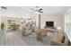 Bright living room open to kitchen and dining area, featuring neutral decor and lots of light at 17718 Sw 112Th Ln, Dunnellon, FL 34432