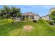 Well-maintained backyard with mature trees and screened-in patio, perfect for outdoor living and entertaining at 17959 Se 89Th Natchez Ave, The Villages, FL 32162