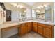 Bright bathroom with double vanity, spacious countertop, and ample cabinet space offering storage at 17959 Se 89Th Natchez Ave, The Villages, FL 32162
