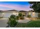 Charming single-story home with a well-manicured lawn and inviting entrance, creating a welcoming curb appeal at 17959 Se 89Th Natchez Ave, The Villages, FL 32162