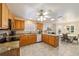 Bright eat-in kitchen featuring wooden cabinets, stainless appliances and granite counters at 17959 Se 89Th Natchez Ave, The Villages, FL 32162