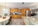 Spacious kitchen featuring granite countertops, stainless steel appliances, and abundant cabinetry at 17959 Se 89Th Natchez Ave, The Villages, FL 32162