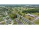 Aerial view of the neighborhood featuring mature trees, and roadways at 1902 Se 37Th Court Cir, Ocala, FL 34471
