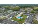Aerial view of the neighborhood featuring a community pool, common areas, and residential housing at 1902 Se 37Th Court Cir, Ocala, FL 34471