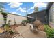 Backyard featuring decorative landscaping, rock features, comfortable seating, and an enclosed patio at 1902 Se 37Th Court Cir, Ocala, FL 34471
