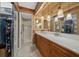 Bathroom with double sinks, granite countertops, and walk-in shower at 1902 Se 37Th Court Cir, Ocala, FL 34471