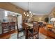 Open dining room with hardwood floors, seamlessly connected to the living room and kitchen, great for entertaining at 1902 Se 37Th Court Cir, Ocala, FL 34471