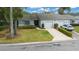 Charming single-story home featuring a well-manicured front lawn and attached garage at 1902 Se 37Th Court Cir, Ocala, FL 34471