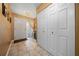Inviting foyer featuring tile flooring, a closet, and a view of the exterior, creating a bright entry at 1902 Se 37Th Court Cir, Ocala, FL 34471