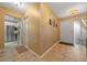 Open foyer leading to a modern kitchen, showcasing tile flooring and a seamless transition to the living areas at 1902 Se 37Th Court Cir, Ocala, FL 34471