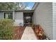 Inviting front entrance featuring a beautifully landscaped walkway leading to the decorative front door at 1902 Se 37Th Court Cir, Ocala, FL 34471