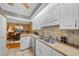 Well-lit kitchen with stainless steel appliances and dining area view at 1902 Se 37Th Court Cir, Ocala, FL 34471