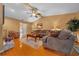 Cozy living room featuring hardwood floors, comfortable seating, and neutral paint at 1902 Se 37Th Court Cir, Ocala, FL 34471