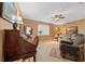 Cozy living room featuring a secretary desk, arm chair, sofa and lots of natural light at 1902 Se 37Th Court Cir, Ocala, FL 34471