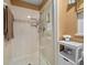 Shower featuring a glass door, modern fixtures, and neutral surround at 1902 Se 37Th Court Cir, Ocala, FL 34471