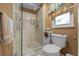Shower featuring a glass door, modern fixtures, and tile surround at 1902 Se 37Th Court Cir, Ocala, FL 34471