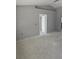 Unfinished living room with freshly painted walls and a doorway leading to other rooms at 1929 Sw 7Th Pl, Ocala, FL 34474