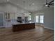 Spacious kitchen featuring a large center island, modern appliances, and plenty of natural light at 1972 Nw 85 Loop, Ocala, FL 34475
