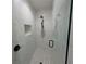 Modern shower with white marble tile, glass enclosure, and matte black hardware at 1972 Nw 85 Loop, Ocala, FL 34475