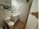 Clean bathroom features a toilet, vanity with sink, and storage cabinet providing functional and tidy space at 20800 River Dr # A17, Dunnellon, FL 34431
