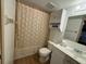 Well-lit bathroom with a shower-tub combo, toilet, and vanity providing a comfortable space for personal care at 20800 River Dr # A17, Dunnellon, FL 34431
