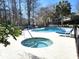 Inviting pool and hot tub area with comfortable lounge seating and a serene setting at 20800 River Dr # A17, Dunnellon, FL 34431