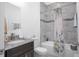 Bright bathroom featuring granite vanity, tub-shower combo, and decorative tiling at 3352 Sw 127Th Lane Rd, Ocala, FL 34473