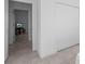 Hallway showcases neutral tile flooring, a bedroom doorway, and closet for ample storage at 3352 Sw 127Th Lane Rd, Ocala, FL 34473