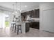 Kitchen island with barstool seating and stainless steel appliances at 3352 Sw 127Th Lane Rd, Ocala, FL 34473