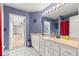 Bathroom with double vanity, ample lighting, and adjacent patio access at 3621 Sw 52Nd Ter, Ocala, FL 34474